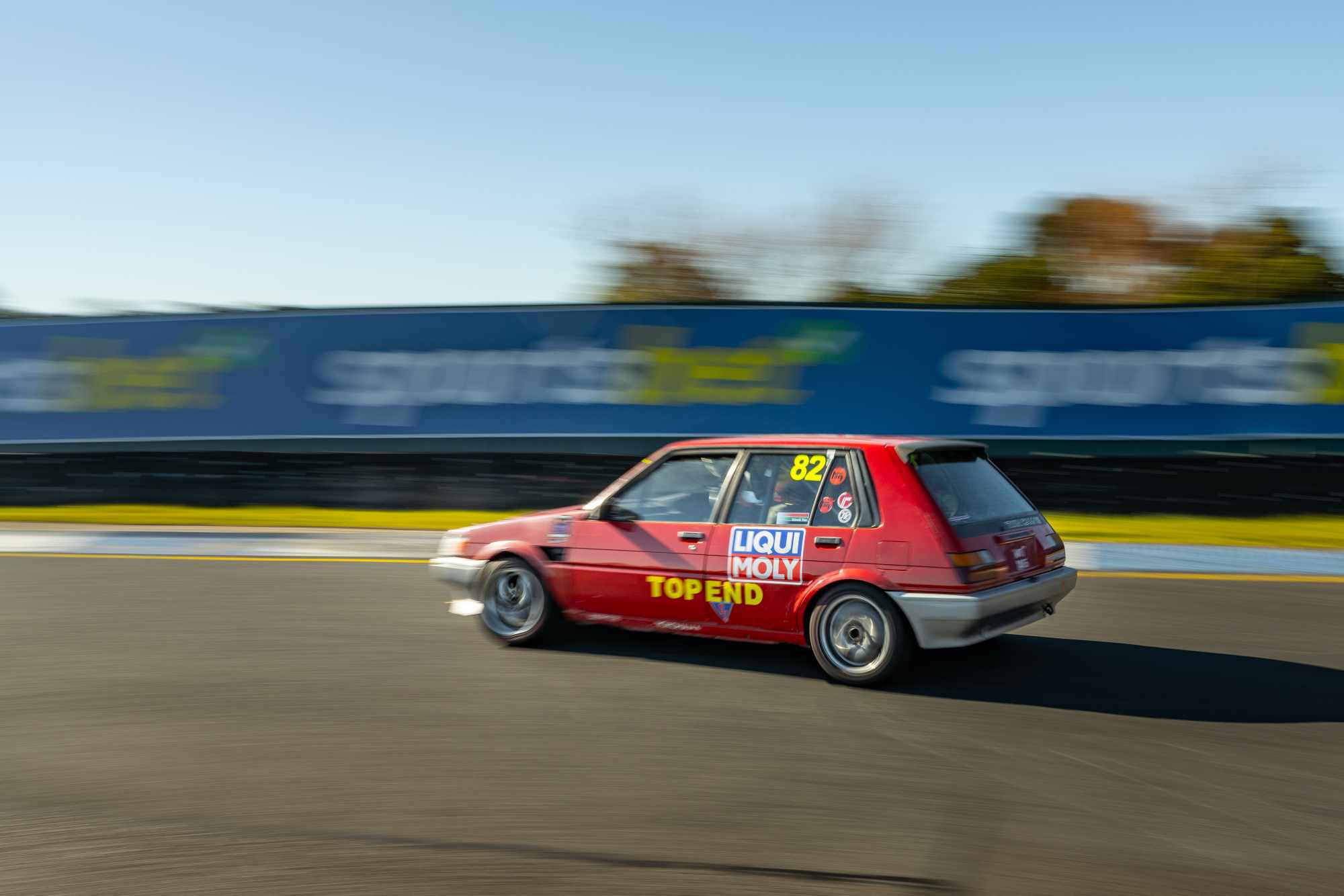 The Top End Corolla at speed on track, panned and slightly blurred