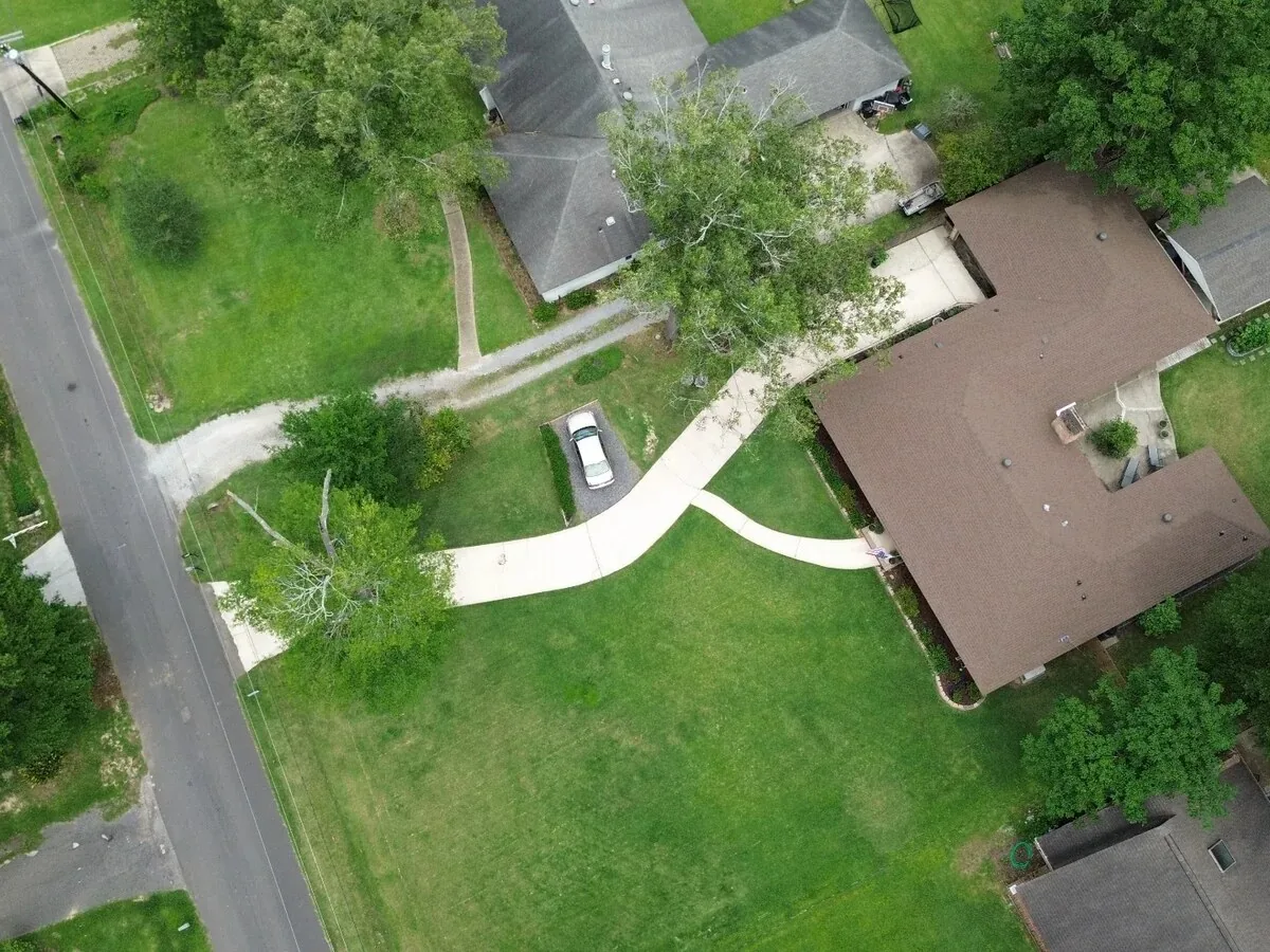 A driveway cleaned by GEAUX Pressure Washing, from the air